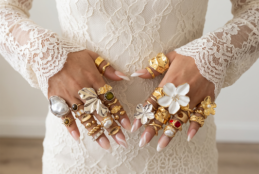 Gold and silver statement jewelry styled with a neutral outfit