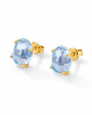 Celeste Blue Topaz Stud Earrings by ZodiGlow, topaz blue gold earrings, angle view