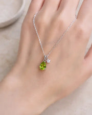 August Peridot Birthstone Teardrop Necklace by ZodiGlow, peridot green birthstone necklace, angle view