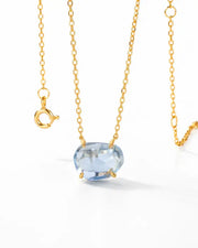 Celeste Blue Topaz Necklace by ZodiGlow, topaz blue gold necklace, angle view