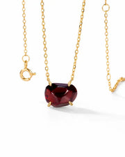 Ember Garnet Necklace by ZodiGlow, garnet gold white necklace, angle view
