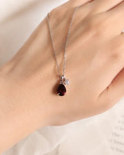 January Garnet Birthstone Teardrop Necklace by ZodiGlow, garnet red birthstone necklace, angle view