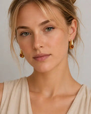 Detail view of Amber Glow Drop Earrings by Zodiglow