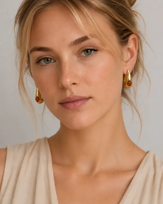 Detail view of Amber Glow Drop Earrings by Zodiglow