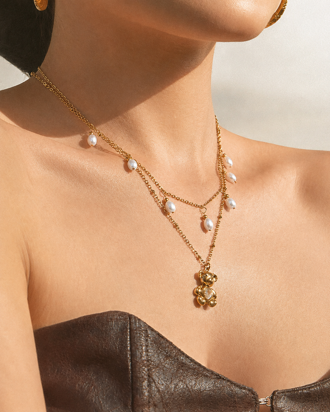 Close-up view of Amora Bear Necklace by Zodiglow