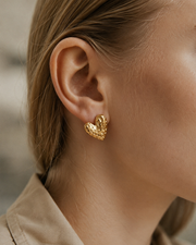 Detail view of Amora Textured Heart Earrings by Zodiglow