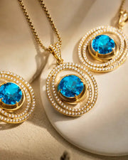 Detail view of Aurelia Azure Orbit Pendant Necklace by Zodiglow