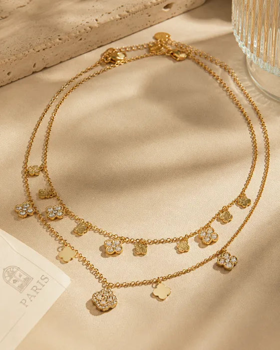 Close-up view of Aurelia Clover Charm Necklace & Bracelet Collection by Zodiglow