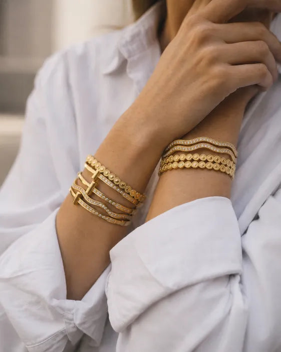 Close-up view of Aureline Sculpted Zircon Bangle Collection by Zodiglow