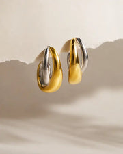 Detail view of Celestia Duo Twist Hoops by Zodiglow