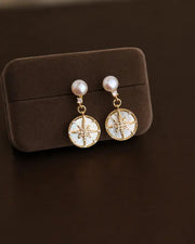 Detail view of Celestia Freshwater Pearl Starburst Drop Earrings by Zodiglow