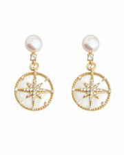 Front view of Celestia Freshwater Pearl Starburst Drop Earrings by Zodiglow