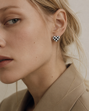 Detail view of Checker Heart Stud Earrings by Zodiglow