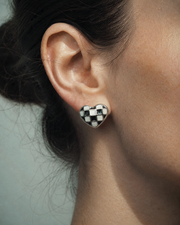 Side view of Checker Heart Stud Earrings by Zodiglow