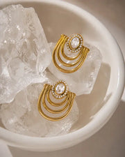 Detail view of Elara Arc White Zircon Earrings by Zodiglow