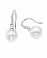 Detail view of Élodie Pearl Arc Zircon Drop Earrings by Zodiglow