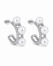 Side view of Élodie Pearl Sculptural Hoop Earrings by Zodiglow