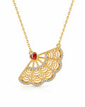 Front view of Gold Filigree Fan Necklace with Garnet Heart by Zodiglow
