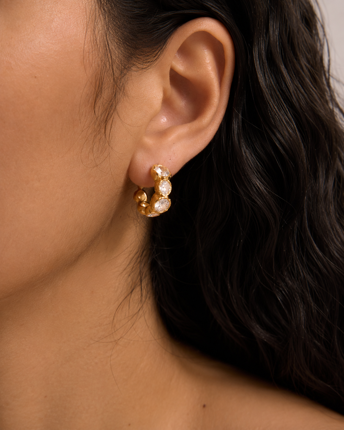Detail view of Graduated Stone Huggie Hoops by Zodiglow