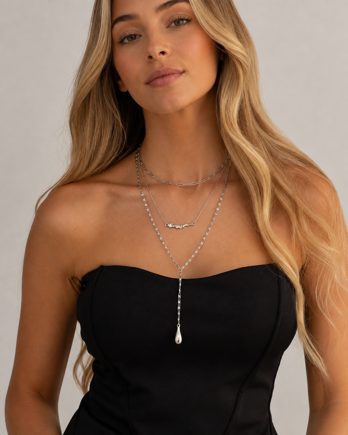 Close-up view of Layered Drop Y Necklace by Zodiglow