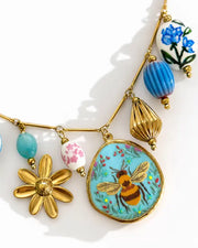 Detail view of Maribel Treasure Charm Necklace by Zodiglow