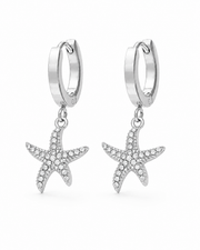 Detail view of Marina Zircon Starfish Huggie Earrings by Zodiglow