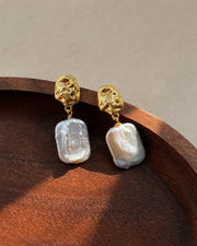 Detail view of Mira Sculpted Baroque Freshwater Pearl Drop Earrings by Zodiglow