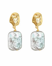 Front view of Mira Sculpted Baroque Freshwater Pearl Drop Earrings by Zodiglow