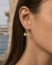 Detail view of Nerina Whale Zircon Huggie Earrings by Zodiglow