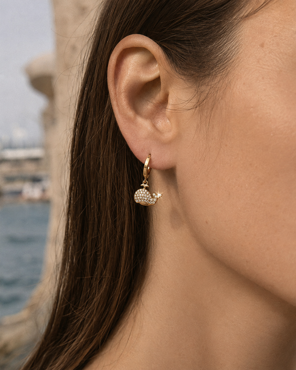 Detail view of Nerina Whale Zircon Huggie Earrings by Zodiglow
