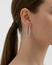 Side view of Nola Hammered Hoop Earrings by Zodiglow
