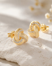 Detail view of Parisian Knot Stud Earrings by Zodiglow