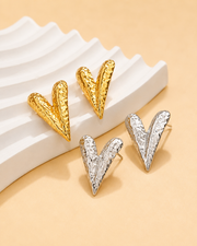 Detail view of Sculpted V Stud Earrings by Zodiglow