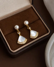 Detail view of Solène Freshwater Pearl Fan Drop Earrings by Zodiglow