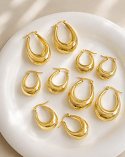 Detail view of Solenne Sculpted Teardrop Hoop Earrings by Zodiglow