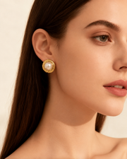 Close-up view of Spiral Disc Stud Earrings by Zodiglow