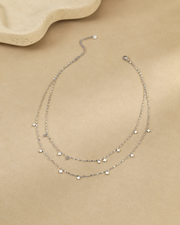 Close-up view of Stella Layered Star Necklace by Zodiglow