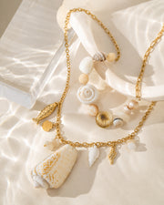 Side view of Thalassa Shell Charm Long Necklace by Zodiglow